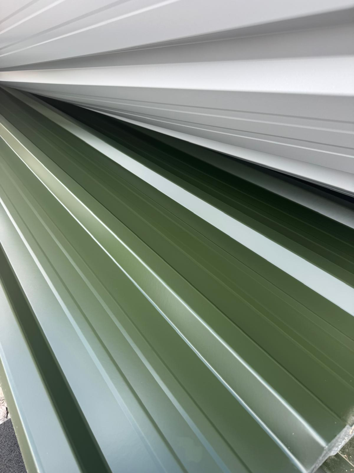 Juniper green polyester coated roofing sheets stacked together